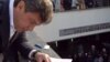 Russian Police Impound Opposition Brochure On Putin 