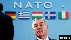 Are Montenegro's pro-Western leaders, including former Prime Minister Milo Djukanovic (pictured), trying to "drag" the Balkan country into NATO against public opinion, as Moscow claims?