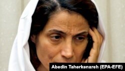 Human rights activist Nasrin Sotoudeh talks on the phone at her house in Tehran, September 18, 2013