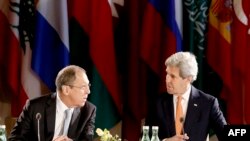 U.S. Secretary of State John Kerry (right) chats with Russian Foreign Minister Sergei Lavrov as they attend talks on Syria in Vienna on May 17. 