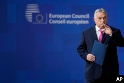 Hungary's Prime Minister Viktor Orban arrives for an EU summit in Brussels on December 14.