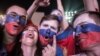 Russian midfielder Roman Zobnin (left) and forward Artem Dzyuba celebrate the team's opening goal against Egypt in St. Petersburg on June 19.