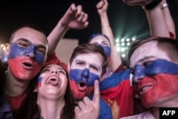 Russian football fans celebrate after their team's victory over Egypt at the Fan Zone in Rostov-on-Don on June 19.