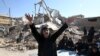 A woman mourns at an earthquake site in Sarpol-e-Zahab in western Iran, November 14, 2017