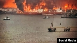 Fires burn in the port of Ust-Luga, Russia, after a Ukrainian strike on the night of March 25. 