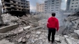 A man looks at destroyed buildings hit by Israeli air strikes in Beirut on the anniversary of the deadly October 7 Hamas attack on Israel. 