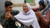 The injured receive treatment at a hospital following a suicide attack in Jalalabad on June 11.