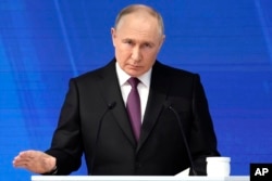 Russian President Vladimir Putin delivers his state-of-the-nation address in Moscow on February 29.