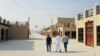 Residents walk at a new state-run development project in the old quarter of Shi'ite town Awamiya, Saudi Arabia January 8, 2019. REUTERS/Stephen Kalin