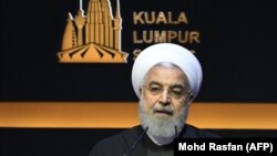 Iranian President Hassan Rohani speaks in Kuala Lumpur on December 19.