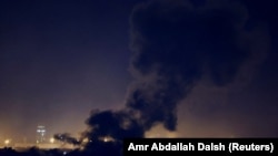 Smoke rises over Beirut's southern suburbs after a strike amid ongoing hostilities between Hezbollah and Israeli forces, as seen from Sin El Fil, Lebanon, on October 1.
