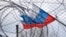 Generic – The flag of Russia on the background of the fence and barbed wire