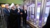President Hassan Rohani (center) reviews Iran's new nuclear achievements during National Nuclear Energy Day in Tehran on April 10.