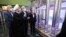 President Hassan Rohani (center) reviews Iran's new nuclear achievements during National Nuclear Energy Day in Tehran on April 10.