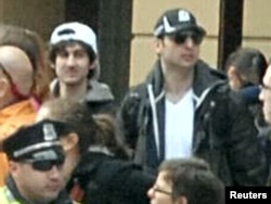 An FBI handout photo of Boston Marathon bombing suspects Dzhokhar (left) and Tamerlan Tsarnaev in the crowd near the finish line on April 15.