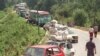 Bosnia-Herzegovina - A convoy of Croatian Serb refugees from Knin wait to cross the Bosnian-Rump-Yugoslav border near the eastern Bosnian town of Raca, 06Aug1995 