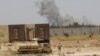 Smoke rises from clashes near Fallujah on May 30.