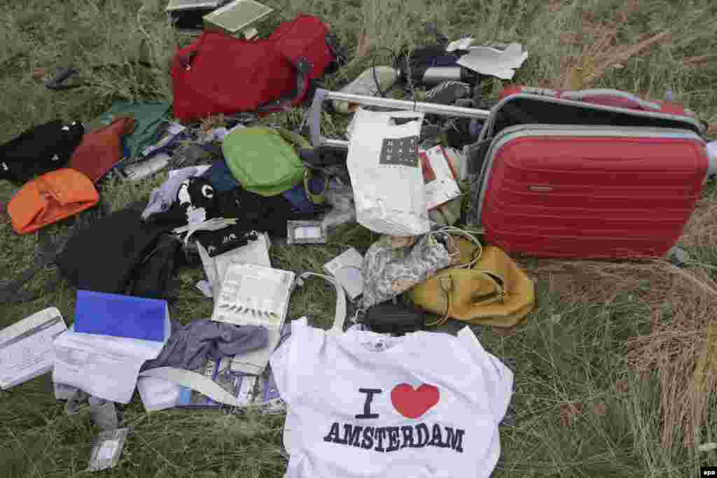 Passengers&#39; personal belongings and luggage amid the debris of the Boeing 777 jet.&nbsp;