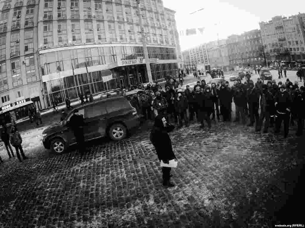 A small group holds an impromptu demonstration against President Viktor Yanukovych.