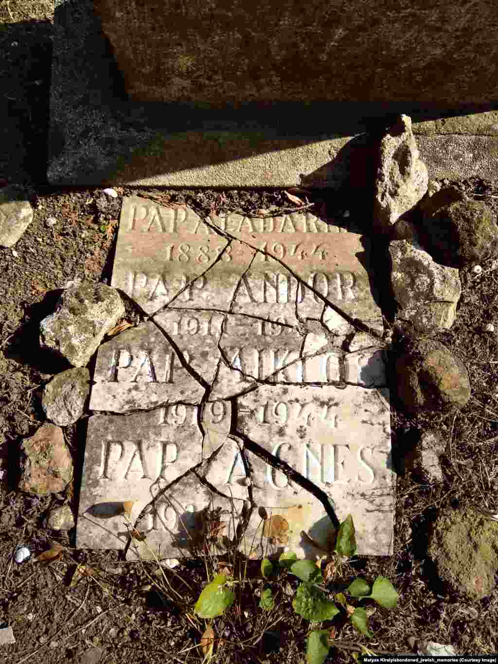 A damaged marker in western Hungary to three Jews who died during the Holocaust. Kiraly told RFE/RL* he seeks out “the oldest and most ruined” remains of Jewish communities.