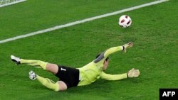 Qatar -- Uzbek goalkeeper Temur Juarev concedes at the 2011 Asian Cup semi-final football match in Doha, 25Jan2011