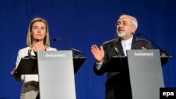 EU foreign policy chief Federica Mogherini and Iranian Foreign Minister Muhammad Javad Zarif speak to reporters after the talks in Lausanne on April 2.