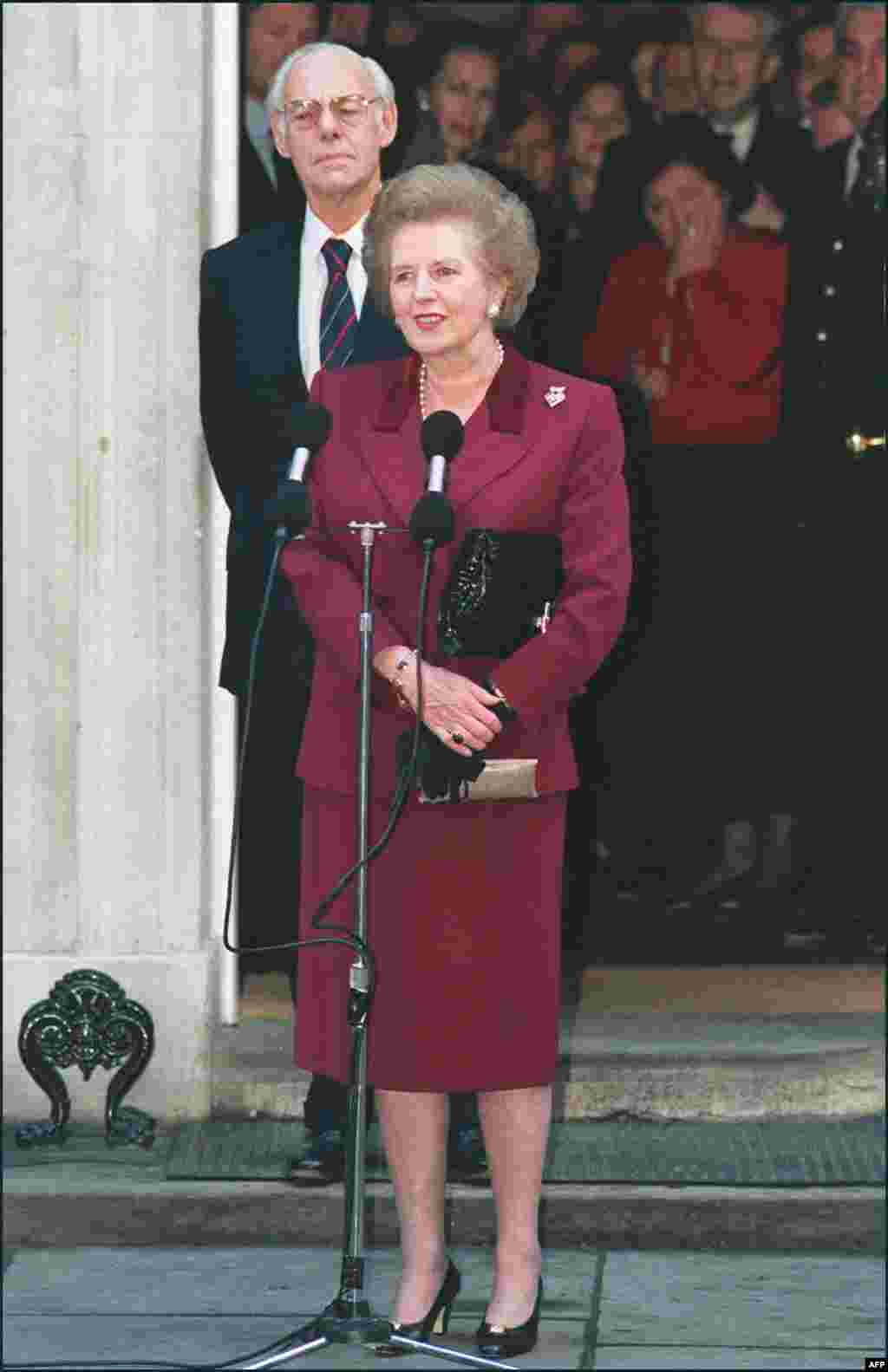 Margaret Thatcher, flanked by her husband, Denis, addresses the press for the last time in front of 10 Downing Street in London in November 1990.