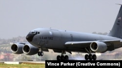 A U.S. Air Force Boeing KC-135R Stratotanker touches down on the flightline at Incirlik air base. 