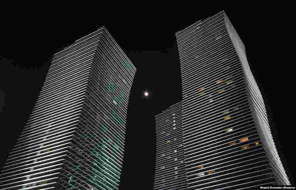 The moon is seen framed between skyscrapers in Astana, Kazakhstan. (Reuters/Shamil Zhumatov)