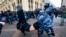 RUSSIA – Police officers detain a man during a protest against the jailing of opposition leader Alexei Navalny in Moscow, Russia, Sunday, Jan. 31, 2021