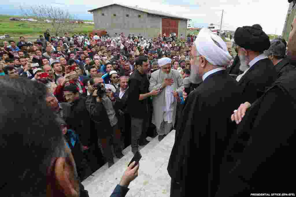 President Rohani visits the flood-affected village of Chan-Sabli in Golestan Province on March 27.