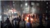Protesters light a fire on the streets of Karaj amid anti-government protests in Iran on January 8. 