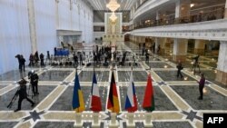 The flags of France, Russia, Germany, Ukraine, and Belarus are prepared at the presidential residence in Minsk ahead of talks set for later on February 11.