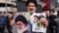 A Shi'a Muslim cleric poses with pictures of Iran's new supreme leader, Ayatollah Mojtaba Khamenei (right), and his late father, Ali Khamenei, during a pro-government rally in central Tehran on March 9. 