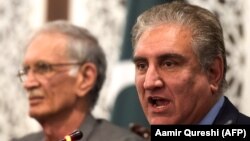 Pakistani Foreign Minister Shah Mehmood Qureshi (right) said the attackers wore military uniforms. (file photo)