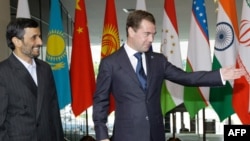 Iran President Mahmud Ahmadinejad (left) with President Dmitry Medvedev at an SCO summit in Yekaterinburg in mid-2009