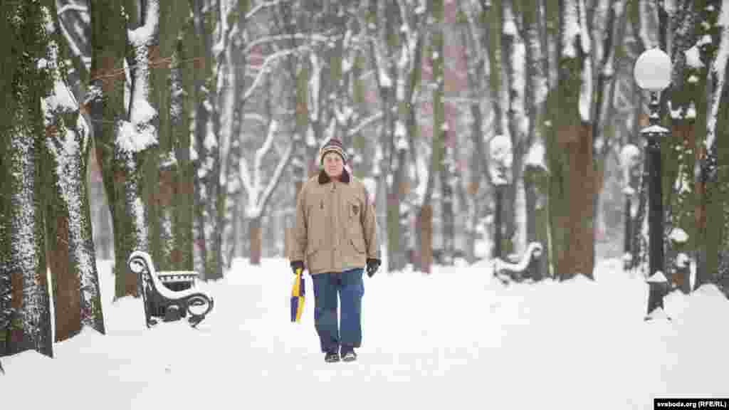 A man walks in a park in the Belarusian capital, Minsk, which is covered in snow this week. (RFE/RL)