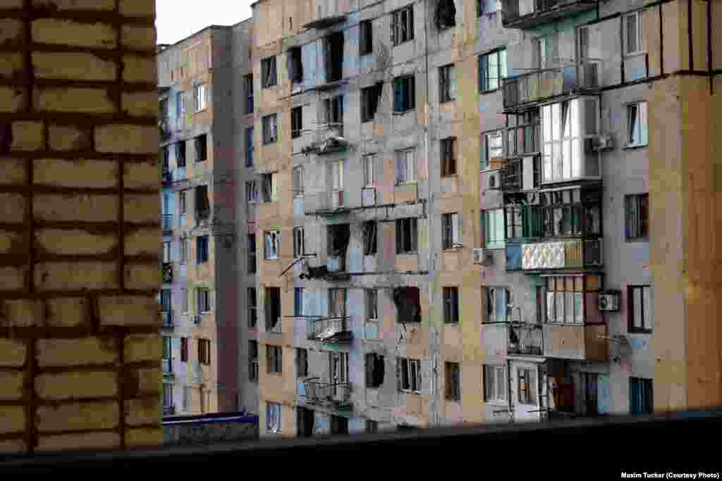 A damaged apartment block in Avdiyivka. Ukrainian soldiers say a separatist tank fired 40 rounds into this residential building. April 7, 2016