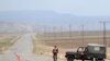 Turkish soldiers guard a road at Dogu Kapi, on the Turkish-Armenian border, on April 15.