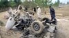 FILE: Security officials inspect the vehicle of a tribal who was killed when his vehicle was hit by a roadside bomb in Bajaur district in November 2015.