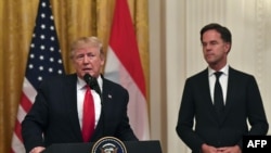 US President Donald Trump speaks with Dutch Prime Minister Mark Rutte during an East Room ceremony at the White House in Washington, DC, on July 18, 2019. 