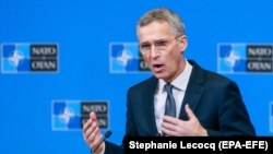 NATO Secretary-General Jens Stoltenberg speaks during a media conference at NATO headquarters in Brussels on December 3.