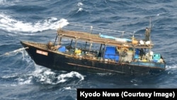 Despite the risks involved, poor North Koreans continue to fish in the Sea of Japan using simple wooden boats. (file photo)