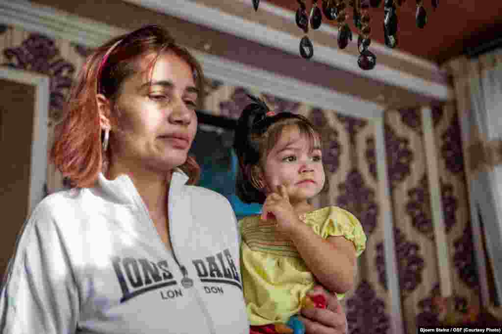 Martina Ferkova with her daughter in their flat at the Stará Tehelňa housing complex, a mainly Romany district in the city of Presov in eastern Slovakia