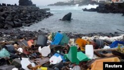 Azores -- A beach in the Azores is pictured littered with plastic garbage, undated