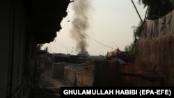 Smoke billows from a prison after a militant attack in the eastern Afghan city of Jalalabad on August 3