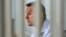 Russian opposition leader Aleksei Navalny attends a hearing at a court in Moscow on June 24.