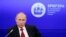 President Vladimir Putin attends a session of the St. Petersburg International Economic Forum on May 23.