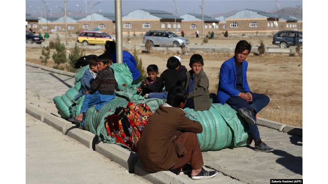Internally displaced Afghans rest in Ghazni on November 15 after fleeing from the Jaghori district to escape ongoing battles between Taliban and Afghan security forces.