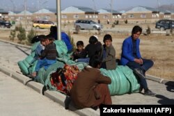 Internally displaced Afghans rest in Ghazni on November 15 after fleeing from the Jaghori district to escape ongoing battles between Taliban and Afghan security forces.